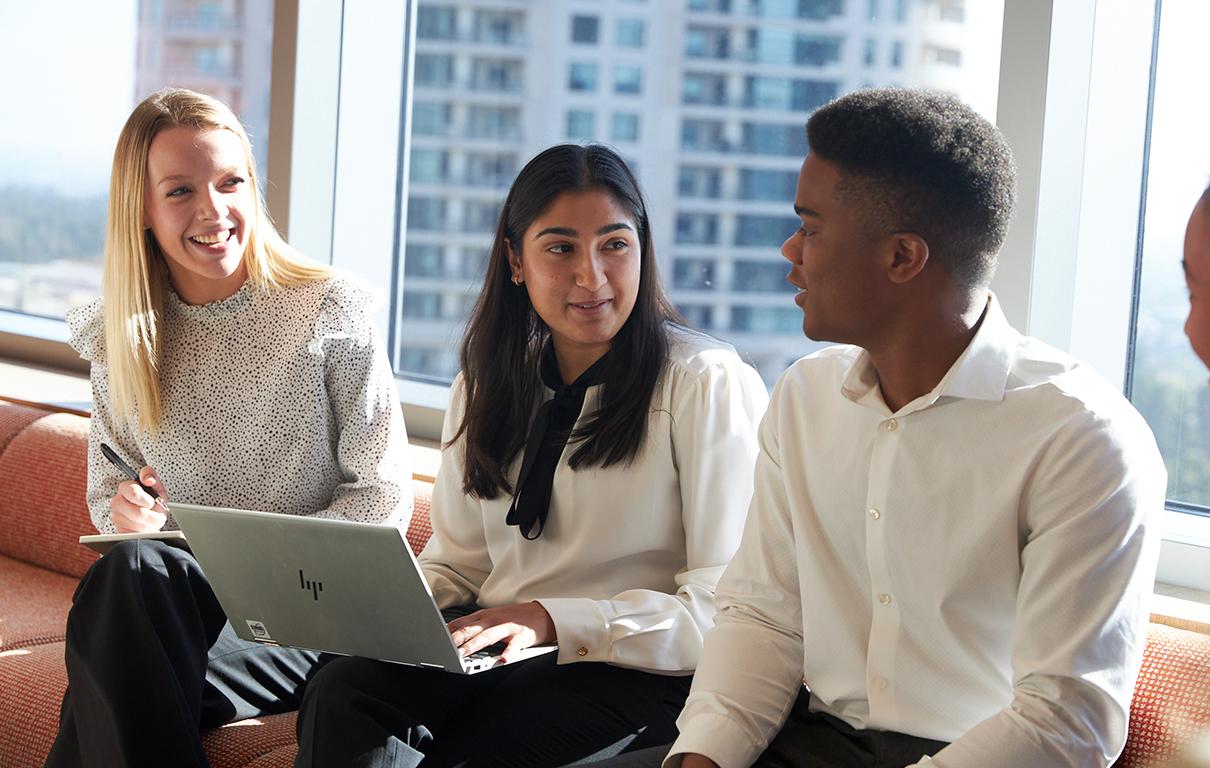 diverse group of Ares professionals sitting together